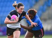 15 December 2023; Niamh Murphy of Newbridge College in action against Diana Izekor of Wlison's Hospital during the Bank of Ireland Leinster Rugby Senior Girls League match between Newbridge College and Wlison's Hospital at Energia Park in Dublin. Photo by Tyler Miller/Sportsfile