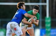 15 December 2023; Tom Larke of Ireland is tackled by Francesco Bini of Italy during the U20 international friendly match between Ireland and Italy at UCD Bowl in Dublin. Photo by Seb Daly/Sportsfile