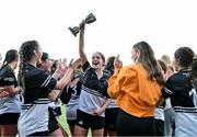 15 December 2023; Newbridge College captain Hollt Bale celebrates with the trophy after their side's victory in the Bank of Ireland Leinster Rugby Senior Girls League match between Newbridge College and The High School at Energia Park in Dublin. Photo by Tyler Miller/Sportsfile