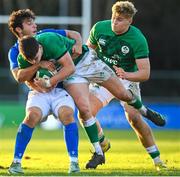 15 December 2023; Tom Larke of Ireland is tackled by Francesco Bini of Italy during the U20 international friendly match between Ireland and Italy at UCD Bowl in Dublin. Photo by Seb Daly/Sportsfile