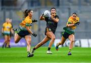 16 December 2023; Laura O'Dowd of Ballinamore-Seán Heslin's in action against Michelle Barry of Glanmire, left, and Ellen Twomey during the Currentaccount.ie LGFA All-Ireland Intermediate Club Championship final match between Ballinamore-Seán O'Heslin's of Leitrim and Glanmire of Cork at Croke Park in Dublin. Photo by Tyler Miller/Sportsfile