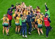 16 December 2023; Glanmire players and management celebrate after the Currentaccount.ie LGFA All-Ireland Intermediate Club Championship final match between Ballinamore-Seán O'Heslin's of Leitrim and Glanmire of Cork at Croke Park in Dublin. Photo by Stephen Marken/Sportsfile
