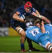 16 December 2023; Josh van der Flier of Leinster is tackled by Ernst van Rhys and Ross Harrison of Sale Sharks during the Investec Champions Cup Pool 4 Round 2 match between Leinster and Sale Sharks at the RDS Arena in Dublin. Photo by Harry Murphy/Sportsfile