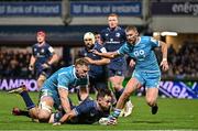 16 December 2023; Hugo Keenan of Leinster is tackled by JL du Preez of Sale Sharks during the Investec Champions Cup Pool 4 Round 2 match between Leinster and Sale Sharks at the RDS Arena in Dublin. Photo by Sam Barnes/Sportsfile