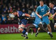 16 December 2023; Joe McCarthy of Leinster is tackled by Asher Opoku-Fordjour of Sale Sharks during the Investec Champions Cup Pool 4 Round 2 match between Leinster and Sale Sharks at the RDS Arena in Dublin. Photo by Harry Murphy/Sportsfile