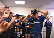 16 December 2023; Garry Ringrose of Leinster puts on his cap after making his 50th Champions Cup appearance in their side's victory in the Investec Champions Cup Pool 4 Round 2 match between Leinster and Sale Sharks at the RDS Arena in Dublin. Photo by Harry Murphy/Sportsfile