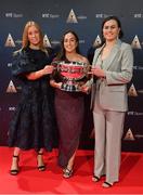 16 December 2023; In attendance during the RTÉ Sports Awards 2023 at RTÉ studios in Donnybrook, Dublin, are Cork Camogie players, from left, Laura Treacy, Amy O'Connor, and Hannah Looney, with the O'Duffy Cup. Photo by Seb Daly/Sportsfile