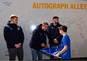16 December 2023; Leinster players, from left Jamie Osborne, Scott Penny and Ross Byrne sign autographs in autograph alley before the Investec Champions Cup Pool 4 Round 2 match between Leinster and Sale Sharks at the RDS Arena in Dublin. Photo by Sam Barnes/Sportsfile