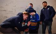 16 December 2023; Leinster players from left, Jamie Osborne, Scott Penny and Ross Byrne sign  autographs in autograph alley before the Investec Champions Cup Pool 4 Round 2 match between Leinster and Sale Sharks at the RDS Arena in Dublin. Photo by Sam Barnes/Sportsfile