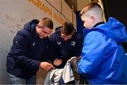 16 December 2023; Leinster players Scott Penny, left, and Ross Byrne sign autographs in autograph alley before the Investec Champions Cup Pool 4 Round 2 match between Leinster and Sale Sharks at the RDS Arena in Dublin. Photo by Sam Barnes/Sportsfile