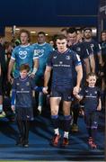 16 December 2023; Leinster co-captain Garry Ringrose walks out with matchday mascots Charlie Flood and Ella Ní Bhuachalla before the Investec Champions Cup Pool 4 Round 2 match between Leinster and Sale Sharks at the RDS Arena in Dublin. Photo by Harry Murphy/Sportsfile