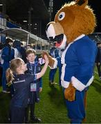 16 December 2023; Match mascots Ella Ní Bhuachalla and Charlie Flood with Leo the Lion before the Investec Champions Cup Pool 4 Round 2 match between Leinster and Sale Sharks at the RDS Arena in Dublin. Photo by Harry Murphy/Sportsfile