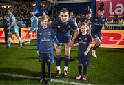 16 December 2023; Leinster co-captain Garry Ringrose walks out with matchday mascots Charlie Flood and Ella Ní Bhuachalla before the Investec Champions Cup Pool 4 Round 2 match between Leinster and Sale Sharks at the RDS Arena in Dublin. Photo by Harry Murphy/Sportsfile