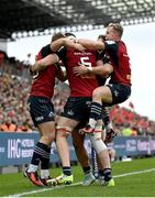 17 December 2023; Tom Ahern of Munster is congratulated by teammates Jack Crowley, left, Alex Nankivell and Craig Casey after scoring their side's second try despite the attention of Tom Cairns of Exeter Chiefs during the Investec Champions Cup Pool 3 Round 2 match between Exeter Chiefs and Munster at Sandy Park in Exeter, England. Photo by Brendan Moran/Sportsfile