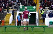17 December 2023; Neil McManus of Ruairí Óg Cushendall leads his side out for the team photograph before the AIB GAA Hurling All-Ireland Club Championship semi-final match between O'Loughlin Gaels, Kilkenny, and Ruairí Óg Cushendall, Antrim, at Páirc Tailteann in Navan, Meath. Photo by Tyler Miller/Sportsfile