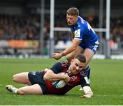 17 December 2023; Shane Daly of Munster scores his side's fourth try despite the tackle of Tom Cairns of Exeter Chiefs during the Investec Champions Cup Pool 3 Round 2 match between Exeter Chiefs and Munster at Sandy Park in Exeter, England. Photo by Brendan Moran/Sportsfile