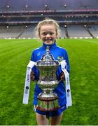 16 December 2023; Koa Peters from Ballymacarbry brings the Dolores Tyrrell Memorial Cup to the pitch before the Currentaccount.ie LGFA All-Ireland Senior Club Championship final match between Ballymacarby of Waterford and Kilkerrin-Clonberne of Galway at Croke Park in Dublin. Photo by Piaras Ó Mídheach/Sportsfile