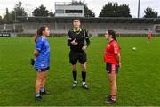 17 December 2023; Referee Ray McBride performs the coin-toss in the company of team captains Rebecca Kean of Claremorris, left, and Lisa Harte of O'Donovan Rossa before the Currentaccount.ie LGFA All-Ireland Junior Club Championship final match between Claremorris of Mayo and O'Donovan Rossa of Cork at Parnell Park in Dublin. Photo by Ben McShane/Sportsfile