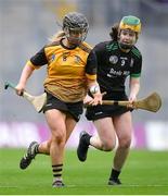 17 December 2023; Aedín Slattery of Na Fianna in action against Kate Lynch of Clanmaurice during the AIB Camogie All-Ireland Intermediate Club Championship final match between Clanmaurice of Kerry and Na Fianna of Meath at Croke Park in Dublin. Photo by Stephen Marken/Sportsfile