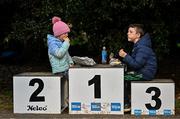 17 December 2023; Zara Casserly, aged 6, and her brother Matthew, aged 9, from Castlegar, Galway enjoy lunch on the podium during the National Race Walking Championships and World Athletics Race Walking Tour Bronze at Raheny Park in Dublin. Photo by Sam Barnes/Sportsfile