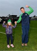 17 December 2023; O'Loughlin Gaels manager Brian Hogan and his daughter Rachel, age six, celebrate after their side's victory in the AIB GAA Hurling All-Ireland Club Championship semi-final match between O'Loughlin Gaels, Kilkenny, and Ruairí Óg Cushendall, Antrim, at Páirc Tailteann in Navan, Meath. Photo by Seb Daly/Sportsfile