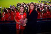 17 December 2023; Éabha O'Donovan of O'Donovan Rossa receives the Player of the Match award from Dorothy Gallagher, Business Development & Relationship Manager, Payac, on behalf of competition sponsors currentaccount.ie, after the Currentaccount.ie LGFA All-Ireland Junior Club Championship final match between Claremorris of Mayo and O'Donovan Rossa of Cork at Parnell Park in Dublin. Photo by Ben McShane/Sportsfile