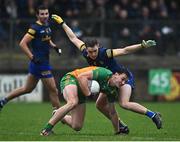 17 December 2023; Michael Langan of Donegal in action against David Murray of Roscommon during the intercounty challenge match, in aid of North West Hospice, between Donegal and Roscommon at Fr Tierney Park in Ballyshannon, Donegal. Photo by Ramsey Cardy/Sportsfile