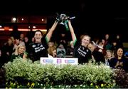 17 December 2023; Clanmaurice joint captains Niamh Leen, left, and Michelle Costello lift the Agnes O'Farrelly Cup after her side's victory in  the AIB Camogie All-Ireland Intermediate Club Championship final match between Clanmaurice of Kerry and Na Fianna of Meath at Croke Park in Dublin. Photo by Stephen Marken/Sportsfile