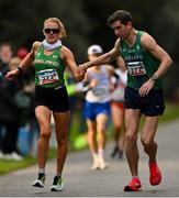 17 December 2023; Brendan Boyce of Ireland takes over from team-mate Kate Veale whilst competing in the marathon mixed relay during the National Race Walking Championships and World Athletics Race Walking Tour Bronze at Raheny Park in Dublin. Photo by Sam Barnes/Sportsfile