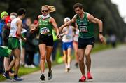 17 December 2023; Brendan Boyce of Ireland takes over from team-mate Kate Veale whilst competing in the marathon mixed relay during the National Race Walking Championships and World Athletics Race Walking Tour Bronze at Raheny Park in Dublin. Photo by Sam Barnes/Sportsfile