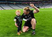 17 December 2023; Laura Collins of Clanmaurice celebrates with her son Ruadh Molloy son age 1, after the AIB Camogie All-Ireland Intermediate Club Championship final match between Clanmaurice of Kerry and Na Fianna of Meath at Croke Park in Dublin. Photo by Piaras Ó Mídheach/Sportsfile