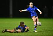 20 December 2023; Emma Henry of North Midlands kicks a conversion with the help of team-mate Emma Jane Wilson during the BearingPoint Sarah Robinson Cup round three match between Metro and North Midlands at Maynooth University in Kildare. Photo by Piaras Ó Mídheach/Sportsfile