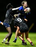 20 December 2023; Vivien Harris of North Midlands is tackled by Teni Onigbode and Giselle O’Donoghue of Metro during the BearingPoint Sarah Robinson Cup round three match between Metro and North Midlands at Maynooth University in Kildare. Photo by Piaras Ó Mídheach/Sportsfile
