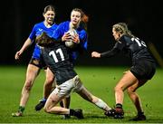 20 December 2023; Vivien Harris of North Midlands is tackled by Siobhan Layte of Metro, 11, during the BearingPoint Sarah Robinson Cup round three match between Metro and North Midlands at Maynooth University in Kildare. Photo by Piaras Ó Mídheach/Sportsfile
