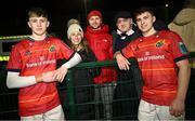 22 December 2023; Brothers Tom, left, and Gordon Wood of Munster, with their family, from left, mother Nicola, brother Alex and dad Keith, after the Development Interprovincial match between Ulster and Munster at Newforge Sports Complex in Belfast. Photo by Ramsey Cardy/Sportsfile
