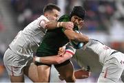 22 December 2023; Byron Ralston of Connacht is tackled by Kieran Treadwell, right, and Jacob Stockdale of Ulster during the United Rugby Championship match between Ulster and Connacht at Kingspan Stadium in Belfast. Photo by David Fitzgerald/Sportsfile