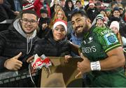 22 December 2023; Bundee Aki of Connacht gives his boots to supporter Tei Chen after the United Rugby Championship match between Ulster and Connacht at Kingspan Stadium in Belfast. Photo by David Fitzgerald/Sportsfile