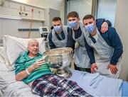 25 December 2023; Liam O'Reilly, from Killyleen, Monaghan, with Dublin footballers Eoin Murchan, Michael Fitzsimons and Brian Howard during the All-Ireland Senior Football Championship winners visit to the Mater Misericordiae University Hospital on Eccles Street in Dublin. Photo by Ray McManus/Sportsfile