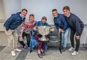 25 December 2023; Mark Peters, from Ballymun, with Dublin footballers Brian Howard, Cian Murphy, Eoin Murchan and Michael Fitzsimons during the All-Ireland Senior Football Championship winners visit to the Mater Misericordiae University Hospital on Eccles Street in Dublin. Photo by Ray McManus/Sportsfile