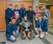 25 December 2023; Mary Rock, aunt of Dublin footballer Dean Rock, from Finglas, poses for a picture with the Sam Maguire Cup alongside Dublin manager Dessie Farrell and players James McCarthy, Michael Fitzsimons, Cian Murphy, Stephen Cluxton, Eoin Murchan, Brian Fenton and Brian Howard during the All-Ireland Senior Football Championship winners visit to the Mater Misericordiae University Hospital on Eccles Street in Dublin. Photo by Ray McManus/Sportsfile