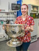 25 December 2023; Staff nurse Karon Murphy, from Dunmore, Galway, with the Sam Maguire Cup during the All-Ireland Senior Football Championship winners visit to Children's Health Ireland at Temple Street in Dublin. Photo by Ray McManus/Sportsfile