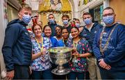25 December 2023; Nurse Aoife Culhane, from, Ballinrobe, Mayo, second from left, and staff pose for a picture with the Sam Maguire Cup alongside Councillor Daithí de Róiste, the 355th Lord Mayor of Dublin, and Dublin footballers during the All-Ireland Senior Football Championship winners visit to Children's Health Ireland at Temple Street in Dublin. Photo by Ray McManus/Sportsfile