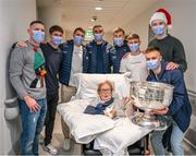 25 December 2023; Anne Grainger, from Navan Road, Dublin, and Dublin players Stephen Cluxton, Michael Fitzsimons, Brian Howard, James McCarthy, Sean Bugler, Cian Murphy, Brian Fenton and Eoin Murchan with the Sam Maguire Cup during the All-Ireland Senior Football Championship winners visit to the Mater Misericordiae University Hospital on Eccles Street in Dublin. Photo by Ray McManus/Sportsfile