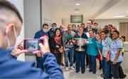 25 December 2023; Eoin Murchan takes a picture of staff with Dublin footballers during the All-Ireland Senior Football Championship winners visit to the Mater Misericordiae University Hospital on Eccles Street in Dublin. Photo by Ray McManus/Sportsfile
