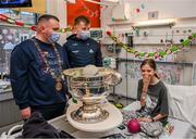 25 December 2023; Laura Cooke, Councillor Daithí de Róiste, the 355th Lord Mayor of Dublin, and Dublin footballer Brian Howard with the Sam Maguire Cup during the All-Ireland Senior Football Championship winners visit to Children's Health Ireland at Temple Street in Dublin. Photo by Ray McManus/Sportsfile