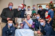 25 December 2023; James Redmond, from Coolafancy, Wicklow, and Dublin footballers with the Sam Maguire Cup during the All-Ireland Senior Football Championship winners visit to the Mater Misericordiae University Hospital on Eccles Street in Dublin Photo by Ray McManus/Sportsfile
