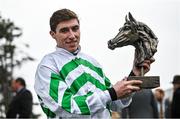 26 December 2023; Jockey Jack Kennedy with the trophy after winning the Racing Post Novice Steeplechase on Found A Fifty on day one of the Leopardstown Christmas Festival at Leopardstown Racecourse in Dublin. Photo by David Fitzgerald/Sportsfile