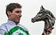 26 December 2023; Jockey Jack Kennedy with the trophy after winning the Racing Post Novice Steeplechase on Found A Fifty on day one of the Leopardstown Christmas Festival at Leopardstown Racecourse in Dublin. Photo by David Fitzgerald/Sportsfile