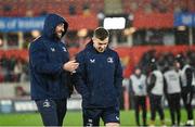 26 December 2023; Jack Conan, left, and Luke McGrath of Leinster walk the pitch before the United Rugby Championship match between Munster and Leinster at Thomond Park in Limerick. Photo by Brendan Moran/Sportsfile