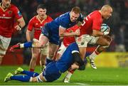 26 December 2023; Simon Zebo of Munster is tackled by Ciarán Frawley and Max Deegan of Leinster during the United Rugby Championship match between Munster and Leinster at Thomond Park in Limerick. Photo by Seb Daly/Sportsfile